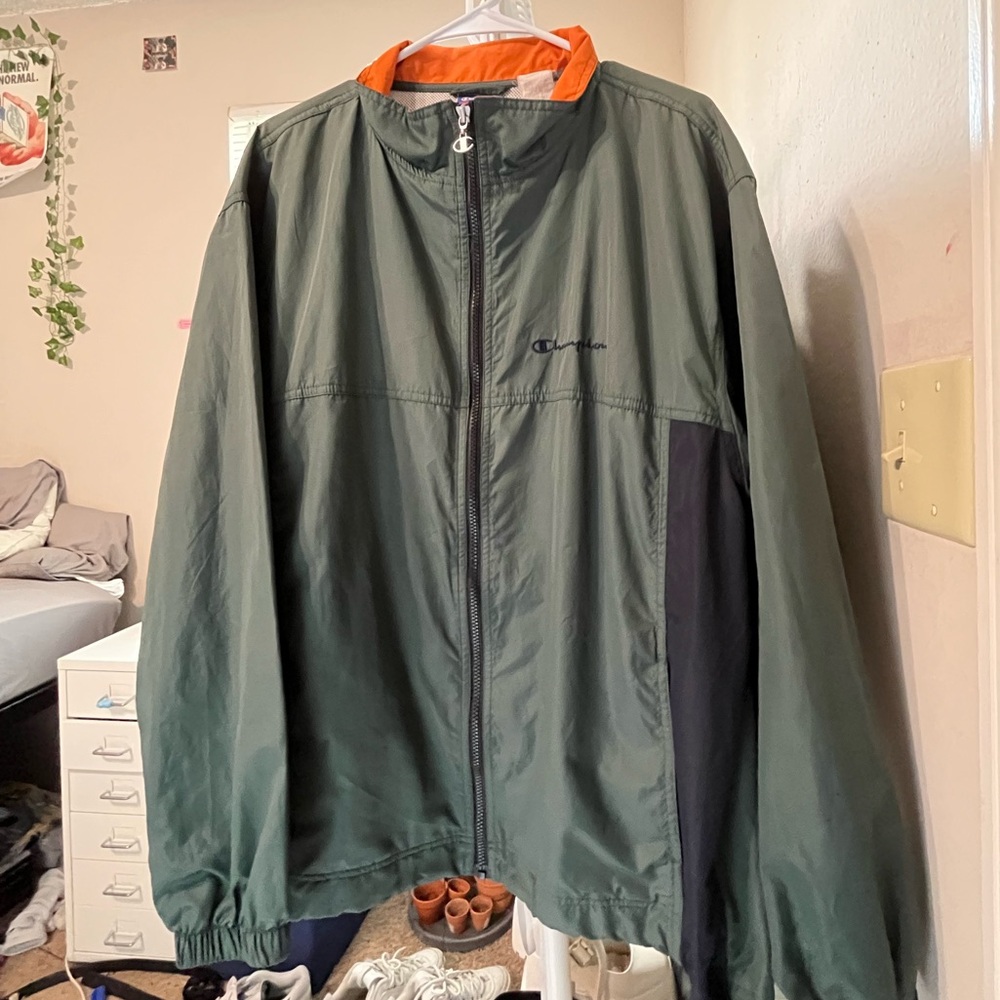 green champion windbreaker with orange accents